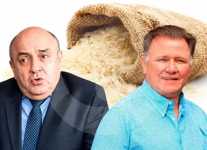dos-hombres-ante-un-saco-de-arroz-51_51796621_20261004114737